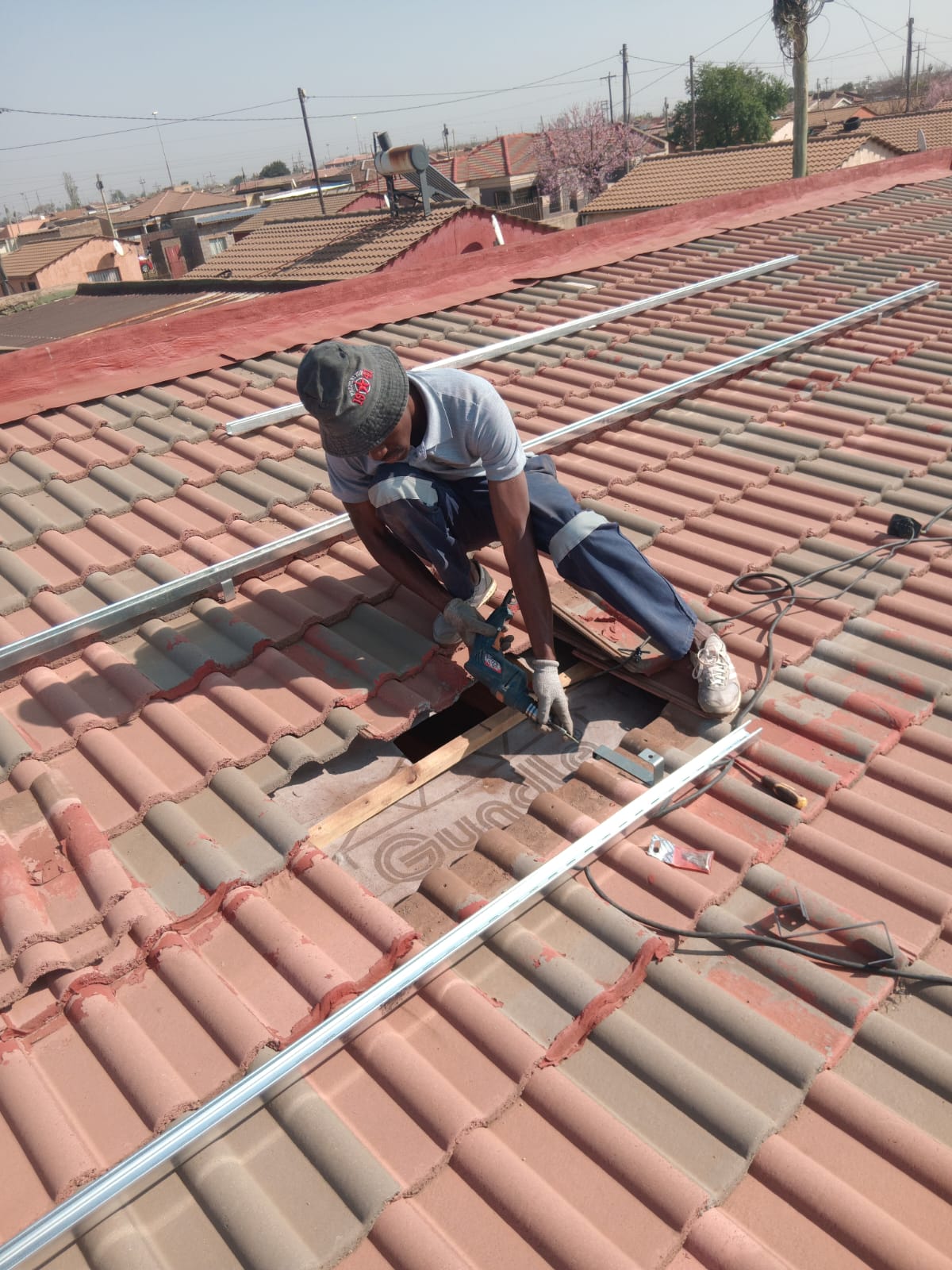 Solar rail installation with roof flashing and waterproofing